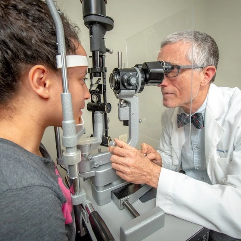 Dr Hickey during an eye exam with a patient